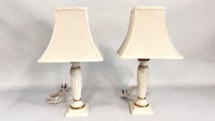 A PAIR OF MODERN TABLE LAMPS WITH CREAM SHADES, HEIGHT 50CM - SOLD AS SEEN.