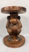 A WOODEN HAND CARVED MONKEY STOOL H 49CM X DIAM 35CM.