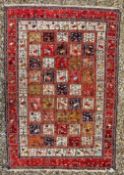 AN EARLY C20th CENTURY PERSIAN, POSSIBLY BAKTIARI RUG A/F, 285 X 195CM.