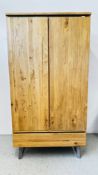 A MODERN OAK FURNITURE LAND SOLID OAK TWO DOOR WARDROBE WITH SINGLE DRAWER BASE W 102CM X D 65.