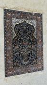 A PERSIAN RUG, THE CENTRAL DESIGN WITH MIHRAB, ANIMALS, BIRDS AND TREES, PERHAPS KASHAN,