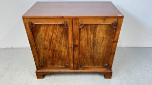 A GEORGE IV TWO DOOR CUPBOARD STANDING ON BRACKET FEET W 100CM D 52CM H 92CM.
