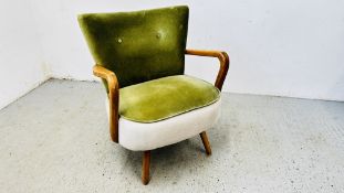 MODERN DESIGNER EASY CHAIR WITH GREEN UPHOLSTERED SEAT AND OPEN ARMS.