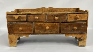 AN ANTIQUE WAXED PINE 7 DRAWER SPICE CHEST W 67 X D 25 X H 35CM.