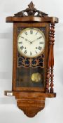A VICTORIAN WALNUT DROP DIAL WALL CLOCK WITH STRIKE - OVERALL HEIGHT 92CM.