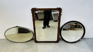 AN ANTIQUE MAHOGANY FRAMED BEVEL EDGE WALL MIRROR, CIRCULAR MIRROR + AN OVAL BRASS MOUNTED MIRROR.
