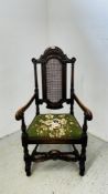A MAHOGANY HIGH BACK ELBOW CHAIR WITH BERGERE WORK TO BACK REST AND CUSHION SEAT.