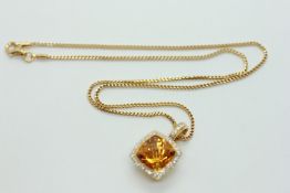 AN 18CT GOLD PENDANT, A SINGLE CITRINE STONE SURROUNDED BY TINY DIAMONDS,