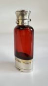 AN ANTIQUE SAMPSON & MORDON SILVER AND RED GLASS SCENT BOTTLE WITH VINAIGRETTE ATTACHMENT,