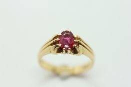 AN 18CT YELLOW GOLD RING SET WITH OVAL CUT RUBY IN CLAW SETTING.