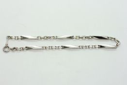 A PLATINUM BATON & LINK BRACELET.