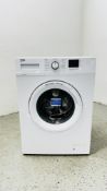 A BEKO 7KG WTK72041W WASHING MACHINE - SOLD AS SEEN.