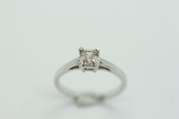 AN 18CT WHITE GOLD SOLITAIRE SQUARE CUT DIAMOND RING.