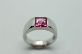 A RUBY RING, SQUARE CUT STONE ON A PLATINUM BAND.