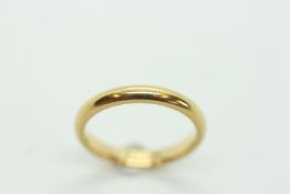 AN 18CT WEDDING BAND.