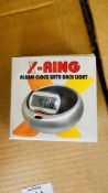 50 X X RING ALARM CLOCKS WITH BLACK LIGHTS.