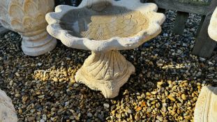 A SHELL DESIGN STONEWORK BIRD BATH - HEIGHT 40CM.