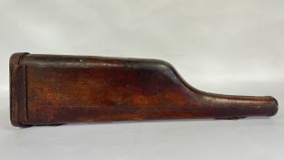 AN ANTIQUE BROWN LEATHER LEG OF MUTTON BEARING A HOLLAND AND HOLLAND DELIVERY LABEL.