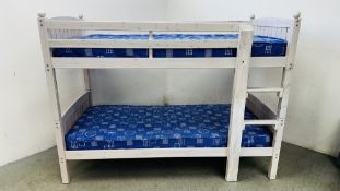 A MODERN WHITE WASHED BUNK BED AND MATTRESSES.