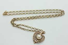 A 9CT GOLD PEARL SET OPEN WORK PENDANT SUSPENDED ON A 9CT GOLD BELCHER CHAIN A/F L 41CM.