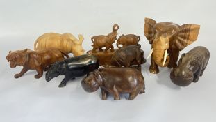 A GROUP OF 8 CARVED WOOD AFRICAN ANIMAL STUDIES ELEPHANTS, RHINO, HIPPO, TIGER.