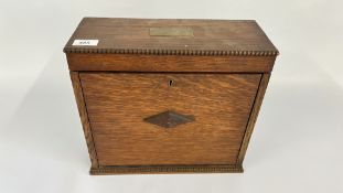 A COMPACT OAK CANTEEN OF CUTLERY, BEARING PRESENTATION PLAQUE.