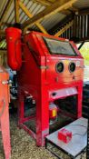 A COMMERCIAL CAT 1200 SHOT BLASTING CABINET - SOLD AS SEEN.