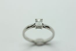 A PLATINUM BAGUETTE SOLITAIRE DIAMOND RING.