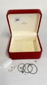 AN OMEGA WATCH BOX WITH VARIOUS OMEGA AND WATCH PARTS TO INCLUDE TWO OMEGA PUSHER BUTTONS,
