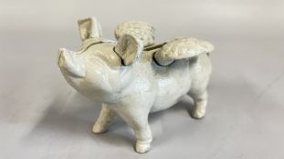 (R) SMALL FLYING PIG FIGURE.