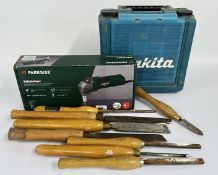 A MAKITA HAMMER DRILL IN A PROTECTIVE HARD CASE,
