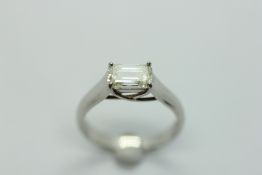 A PLATINUM AND DIAMOND SOLITAIRE RING, THE BAGUETTE CUT STONE CLAW SET.