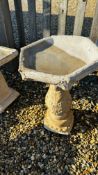 A PEDESTAL STONEWORK BIRD BATH,