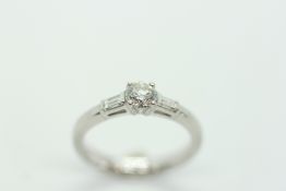 A PLATINUM DIAMOND RING, THE SPREAD OF THE PRINCIPLE BRILLIANT CUT STONE MEASURING APPROX 5 MM,