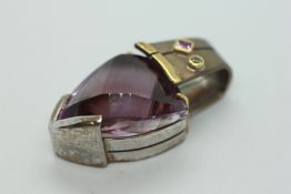 A SILVER AND AMETHYST DESIGNER PENDANT BY JOHN WOOLFE,