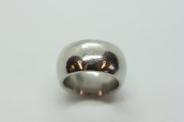 A HEAVY PLATINUM WEDDING BAND.