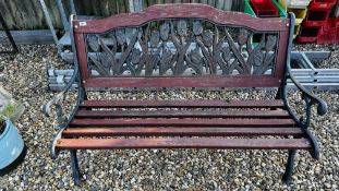 A GARDEN BENCH WITH DECORATIVE CAST METAL ENDS AND BACK REST - LENGTH 125CM.