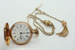 A 14CT GOLD SMALL SIZE HUNTER POCKET WATCH BY WALTHAM SUSPENDED ON A CHAIN MARKED REAL GOLD,