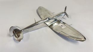 AN ALUMINIUM DESK TIDY ORNAMENT OF A AIRCRAFT.
