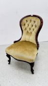 A VICTORIAN MAHOGANY SPOON BACK NURSING CHAIR.