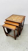 NEST OF 3 MID CENTURY TEAK FRAMED COFFEE TABLES WITH TILED TOP.