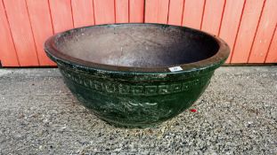 A VERY LARGE GREEN PAINTED TERRACOTTA PLANTER OF CLASSICAL DESIGN.