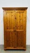 A HONEY PINE DOUBLE WARDROBE W 107CM D 55CM H 195CM.