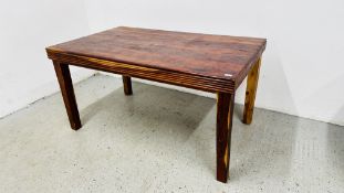 A RUSTIC HARDWOOD DINING TABLE 150CM X 92CM.