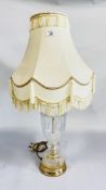 A PRESSED CLEAR GLASS TABLE LAMP WITH FRINGED SHADE - SOLD AS SEEN.