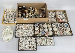 AN EXTENSIVE GROUP OF CABINET COLLECTIBLES TO INCLUDE MINIATURE TEAPOTS,