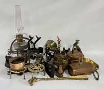 A GROUP OF MIXED METAL AND BYGONE ITEMS INCLUDING FIRE IRONS, TRIVETS, CANDLESTICKS, BLOW TORCH,