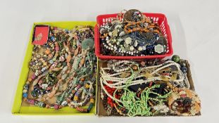 THREE TRAYS CONTAINING AN EXTENSIVE COLLECTION OF ASSORTED BEADED AND HARD STONE NECKLACES ETC.