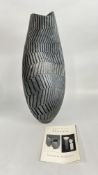 ASHRAF HANNA: A BLACK STONEWARE VASE OF DENTED OVOID SHAPE,