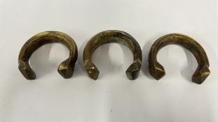 THREE VINTAGE AFRICAN BRONZE CUFF CURRENCY OR CEREMONIAL ARMLETS / BRACELETS.